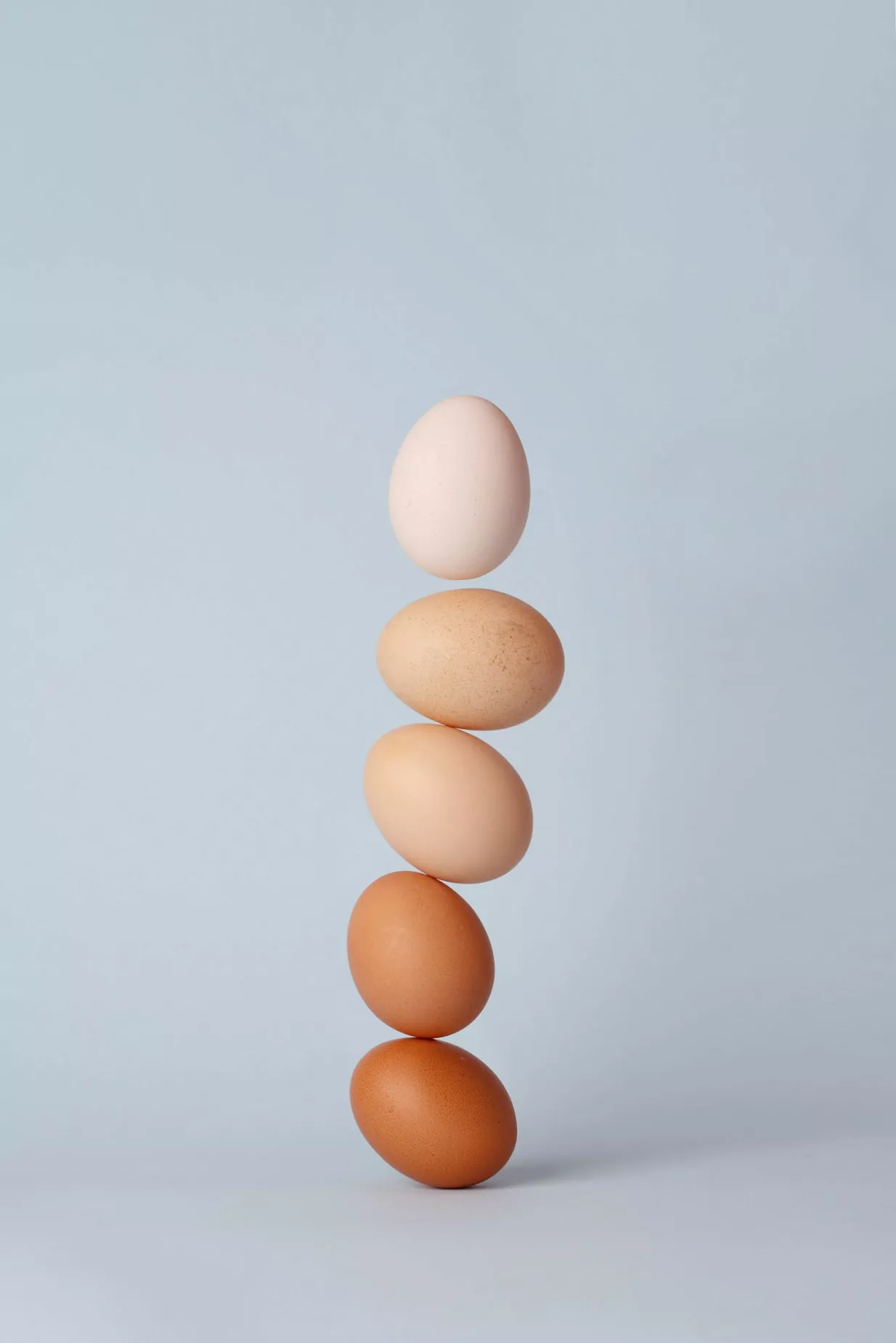 Different Kinds Of Eggs Stacked In A Row