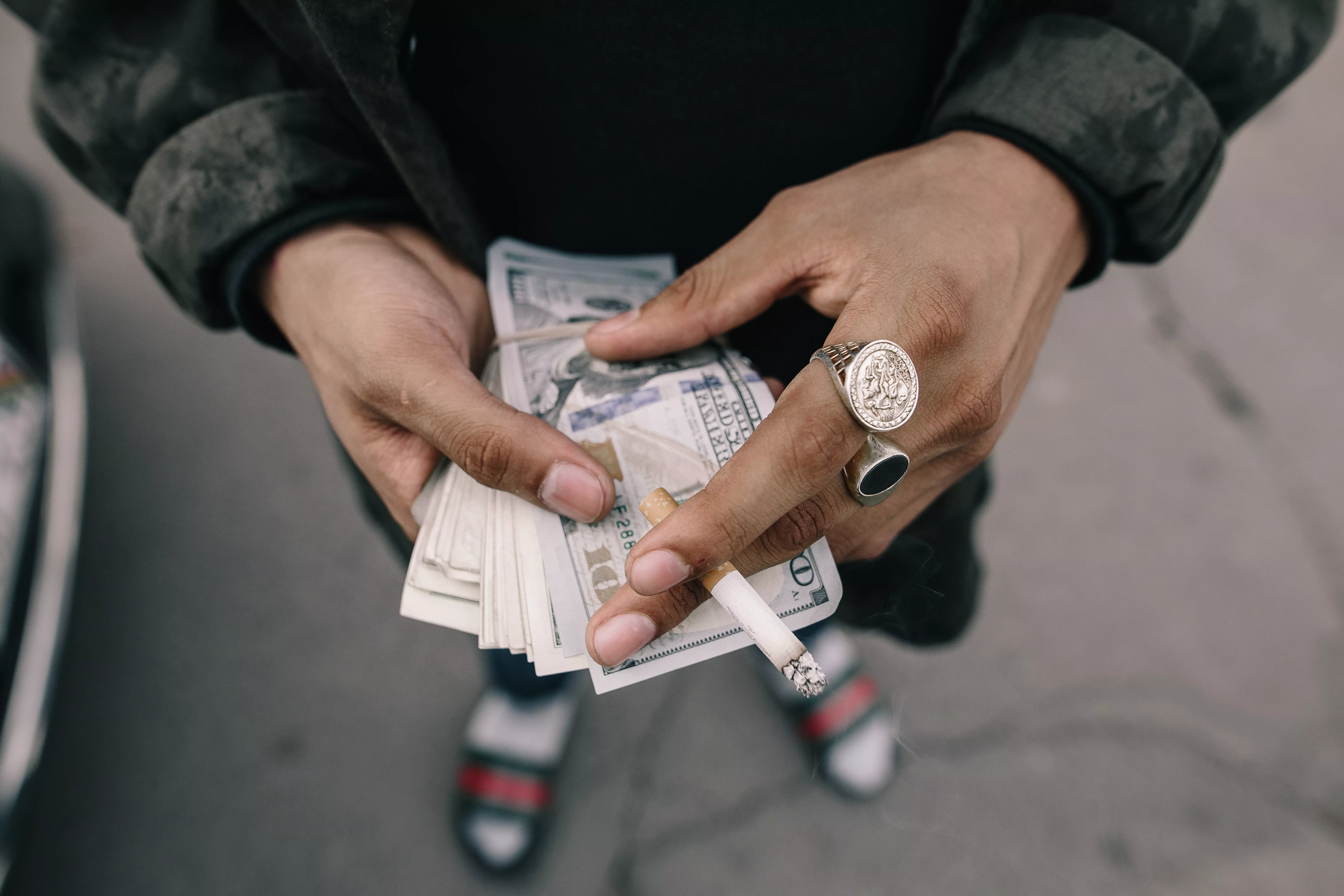 Man holding dirty money