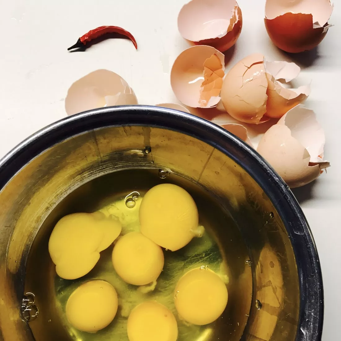 6 Raw Egg Yolks In A Bowl